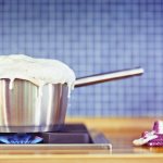 Milk boils out of the pan
