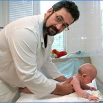 Examination of a baby by an orthopedist