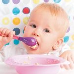 Child eats independently with a spoon