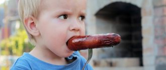 A child tries a sausage